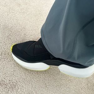 Nurture Tennis Shoe Black, White and Neon Green on the bottom and tip of shoe